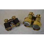 2 pairs of brass binoculars, one marked
