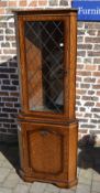 Oak corner cupboard with leaded glass pa