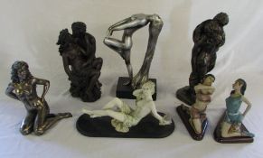 Various figurines including embracing co