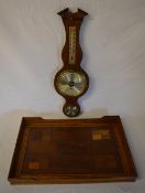 Wooden tray and a wall barometer