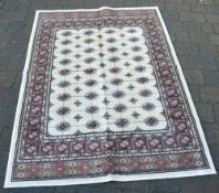 Ivory ground Kashmir rug with a traditio