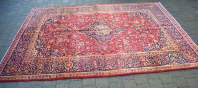 Red ground Persian Kashmir carpet with a