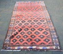 Red ground Afghan carpet with all over B