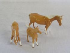 Royal Doulton Palomino mare DA55 with tw