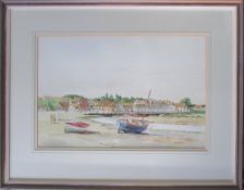 Framed watercolour of a beach scene by M