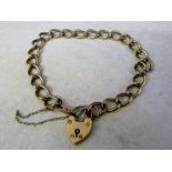 9ct gold curb bracelet with padlock weig