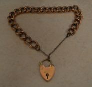 9ct gold padlock on a rose-gold coloured