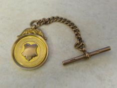 9ct gold fob engraved 'Hett Cup 1922-23