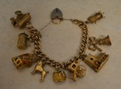 A 9ct gold charm bracelet with 9 differe