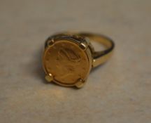 9ct gold ring with a mounted 1853 1 Doll