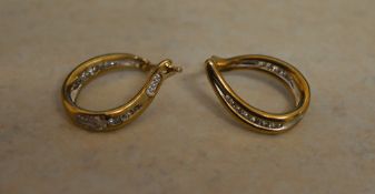 Pair of 9ct gold and diamond earrings, a