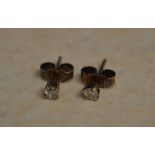 Pair of small 9ct gold diamond earrings,