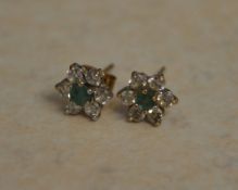 Tested as 9ct gold pair of Emerald and C