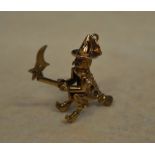 A 9ct gold charm / pendant of a witch fl
