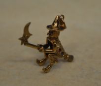 A 9ct gold charm / pendant of a witch fl