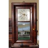 An American wall clock in ogee mahogany case by E N Welch, glazed door decorated Capital at Albany