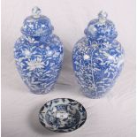 An 18th Century provincial shallow dish, 6" dia, and a pair of bird and flower decorated jars and