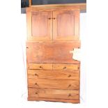 A mid 20th Century bureau abattant fitted central fall flap, cupboard over enclosed two doors,