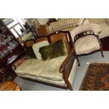 A bergere three-seat settee with caned back and sides, cushions covered in a green floral brocade,