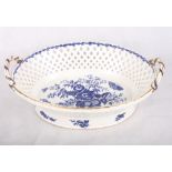 A Worcester oval two-handled chestnut basket, sides pierced lozenge design, base decorated pine