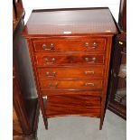 An Edwardian satinwood banded mahogany sheet music cabinet, fitted four drawers and undershelf,