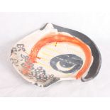 An irregular shaped raku shallow bowl by Jane Longrigg