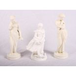 A pair of Worcester blanc de chine figures of a lady with a bird, 9 1/2" high, and another figure of