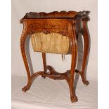 An early 19th Century continental walnut and inlaid work table with tray top, fitted single drawer