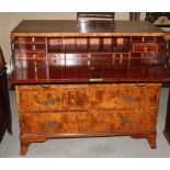 A George III mahogany chest fitted secretaire drawer and three lower drawers with pierced brass