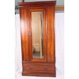 A late Victorian mahogany wardrobe enclosed centre mirror door, fitted drawer to base, 39" wide