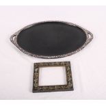 A black papier-mache oval two-handled tray decorated mother-of-pearl, 16" wide, and an ebonised