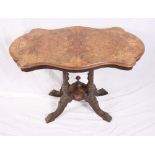 A late Victorian figured walnut shape top occasional table, on four turned columns and splay