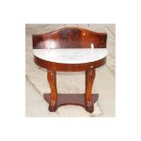 A Victorian mahogany half round washstand with white marble top and later mahogany back, 36" wide