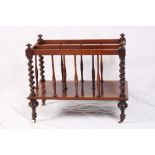 An early 19th Century rosewood two-division Canterbury with spiral turned pillars, on turned
