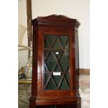 A late Victorian mahogany and box strung corner display cabinet enclosed astragal glazed door, on