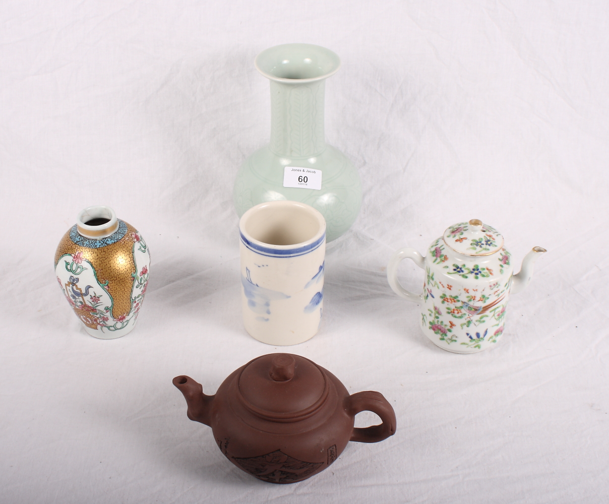 A Chinese Yixing teapot, a Celadon vase, a famille verte wine pot and other oriental ceramics