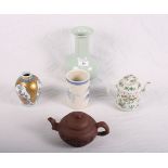 A Chinese Yixing teapot, a Celadon vase, a famille verte wine pot and other oriental ceramics