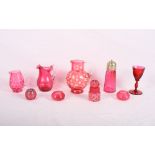 A Victorian ruby glass jug enamelled flowers and a number of other pieces of ruby glass