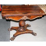 A William IV period rosewood fold-over top card table with circular red baize playing surface, on