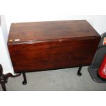 A Georgian Cuban mahogany drop leaf dining table, on tapered supports and pad feet, 36" wide