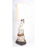 A 19th Century oriental porcelain figure of Kuan Yin fitted as a table lamp, on wooden base, 16"