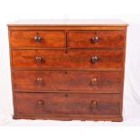 A 19th Century mahogany chest of two short and three long drawers with turned wood knobs (lacking