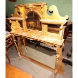 A 19th Century gilt wood framed overmantel mirror fitted bevelled plate mirrors and shelves, 44"