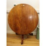 A 19th Century mahogany circular tilt top dining table, stamped with broad arrow and dated 1935,