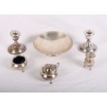 A silver pedestal dish, a silver three-piece cruet and a pair of filled silver candlesticks, 11oz