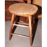 Three spindle back kitchen chairs, two wooden stools, a bentwood stool and a cane seat occasional