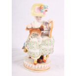 A 19th Century Meissen porcelain figure of a child with a puppy, 6" high