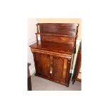 An early 19th Century mahogany chiffonier, fitted two shelves over base fitted frieze drawer and