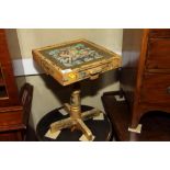 A gilt decorated square occasional table, top painted Indian couple riding a camel, on cruciform