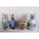 Two large Chinese blue and white vases, a smaller vase (now converted to a lamp) and a Chinese